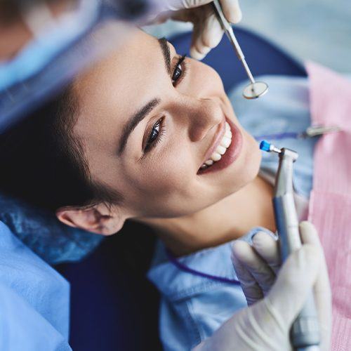Woman receiving advanced dental cleaning