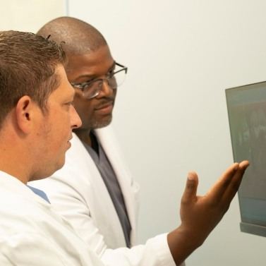 Two Arlington Heights dentists looking at dental x rays