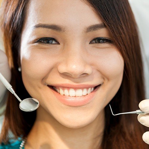 Woman receiving a preventive dentistry checkup