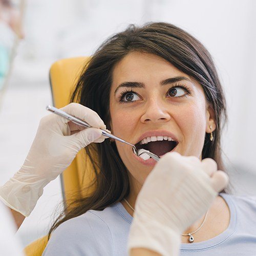 Woman having wisdom tooth removed
