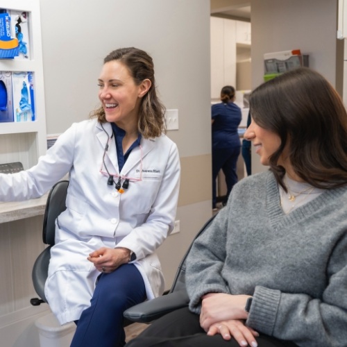 Dentist with a patient pointing to something out of view