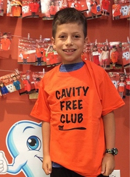 Little boy wearing cavity free club shirt