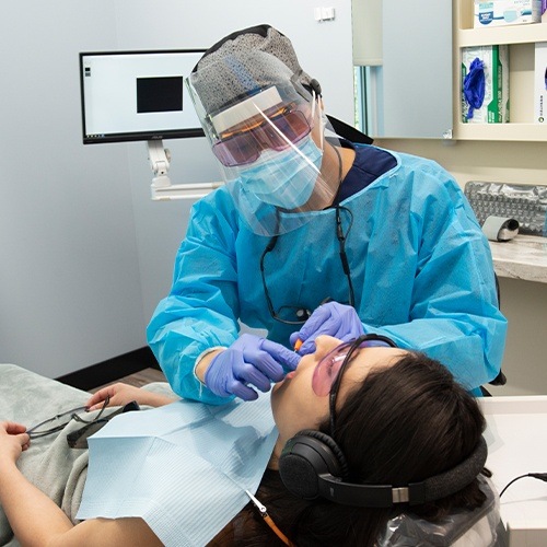 Patient receiving teeth cleaning