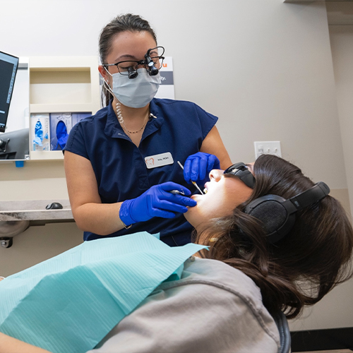 Woman receiving a professional teeth cleaning