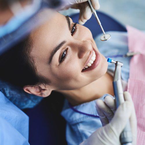Woman smiling right before a dental cleaning