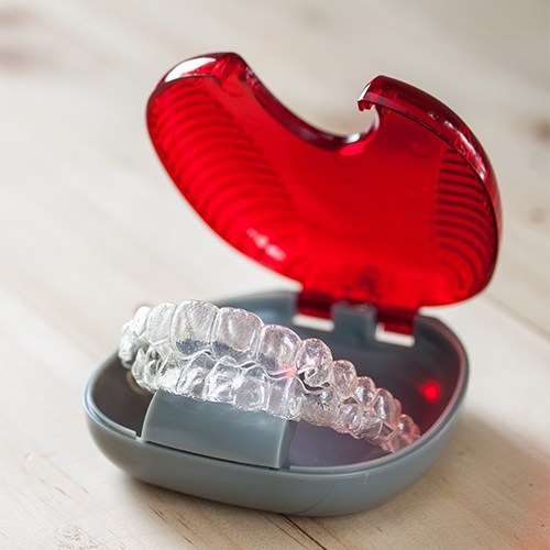 Set of Invisalign trays in a carrying case
