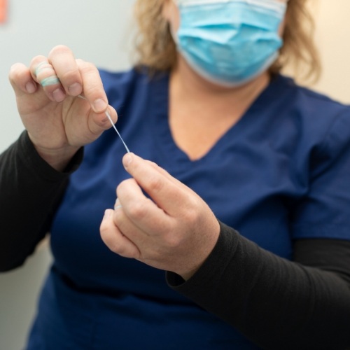 Man flossing after dental crown restoration