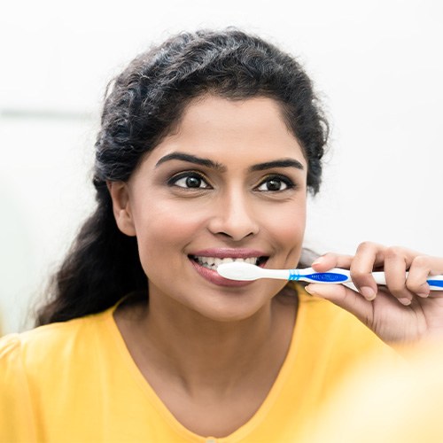 Woman brushing her teeth