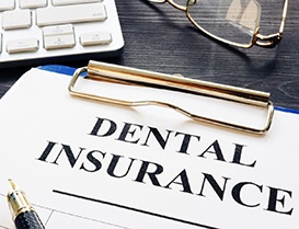 Dental insurance form on clipboard