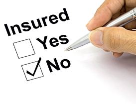 Person checking no box on form asking if they are insured