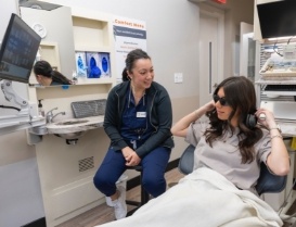 Woman wearing sunglasses in dental chair