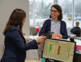 Dental patient smiling at receptionist
