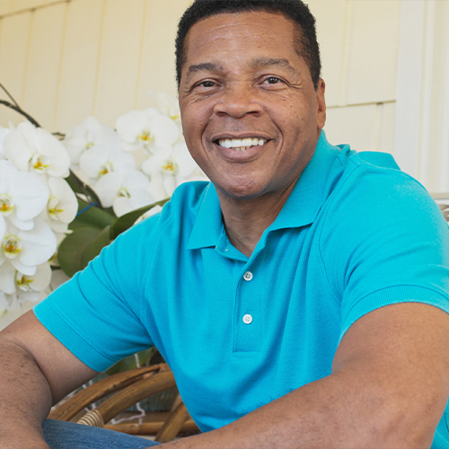 Smiling man in blue polo shirt
