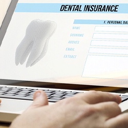 Patient reviewing dental insurance information on computer