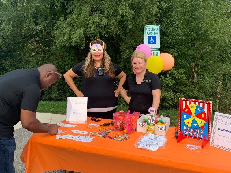 Team members playing games with patients the grand opening event