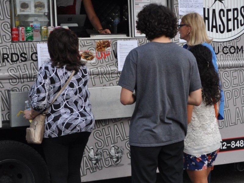 Team members getting food from the food truck social event