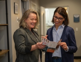 Dental team member showing a patient a pamphlet