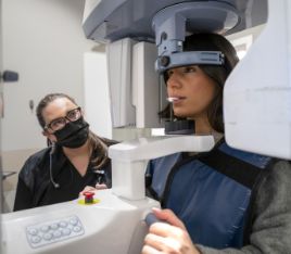 Dental patient getting a scan taken of her mouth and jaw