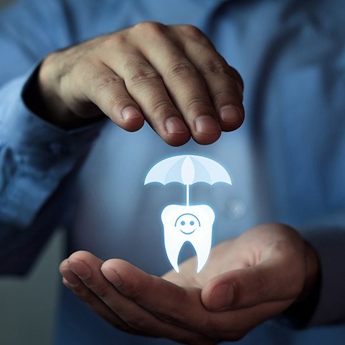 Hands holding animated tooth under an umbrella