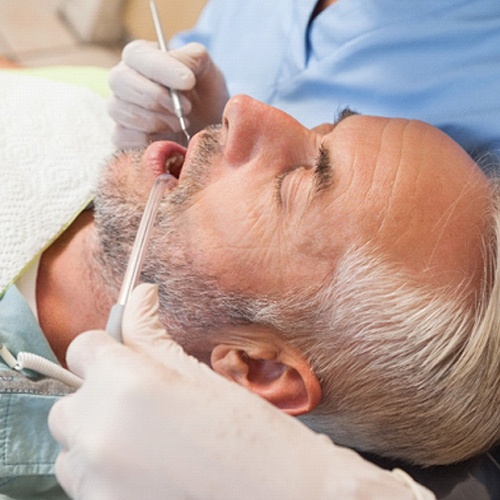 Middle-aged man resting during his dental appointment