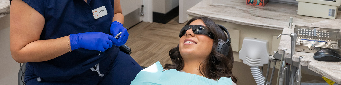 Woman receiving treatment from dentist near Palatine