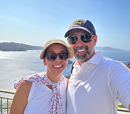 Doctor Kics and his wife smiling on the beach