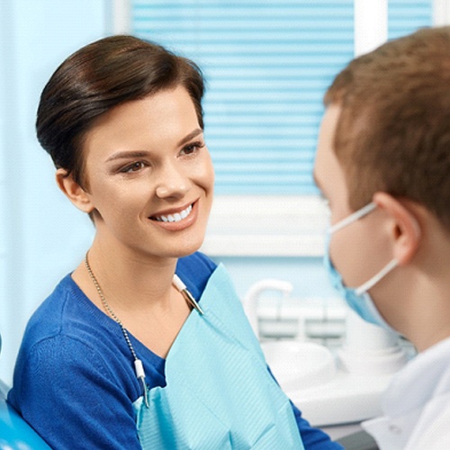 Woman smiling at dentist in Arlington Heights