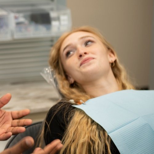 Woman leaning back in dental chair