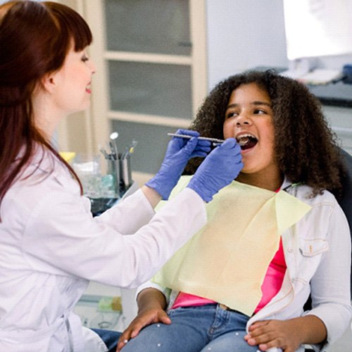 Young girl undergoing a dental cleaning