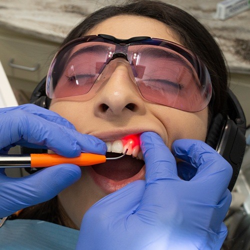Patient receiving laser periodontal therapy