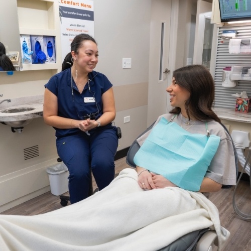 Dentist and patient discussing gum disease treatment options