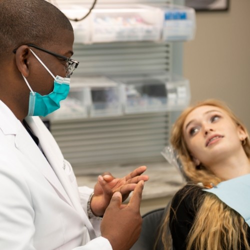 Young woman listening to her dentist
