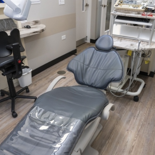 Empty black dental treatment chair