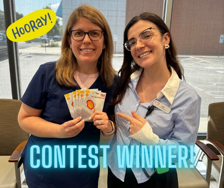 Dentist and patient smiling together