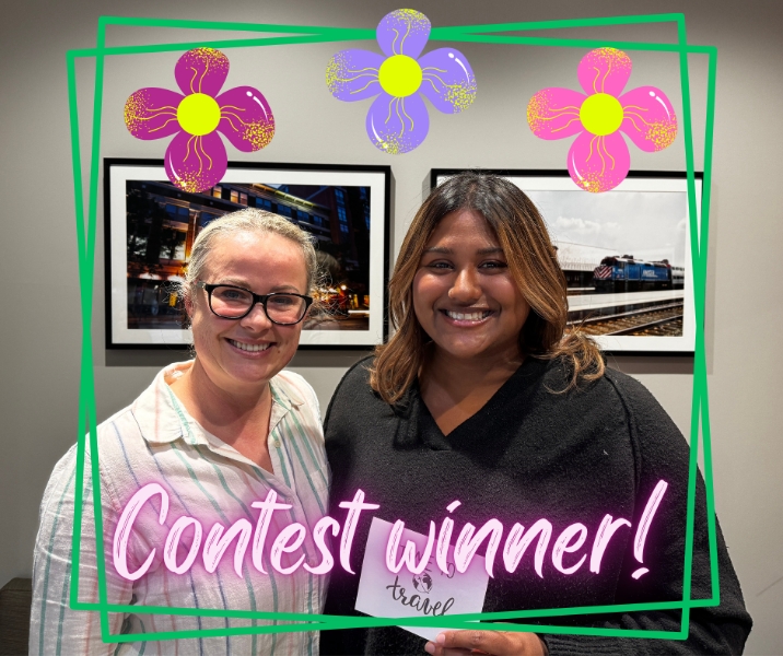 Dentist and patient smiling together