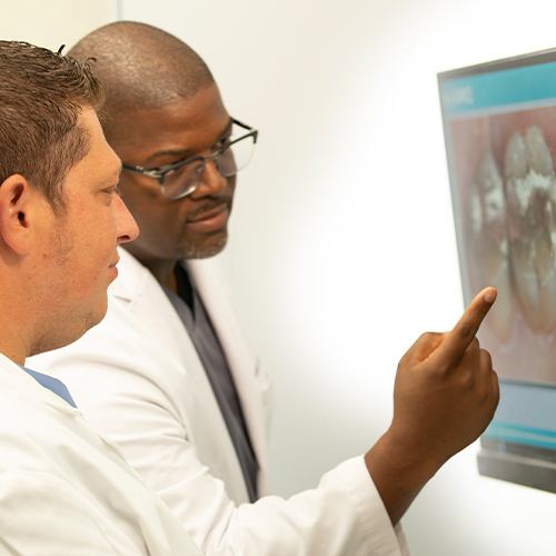 Dentist reviewing dental patient case