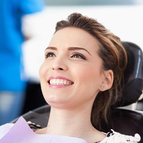 Woman smiling after root canal therapy
