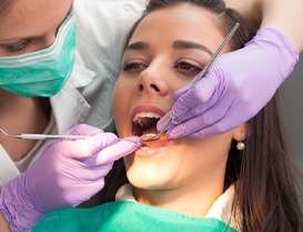 woman getting root canal in Arlington Heights