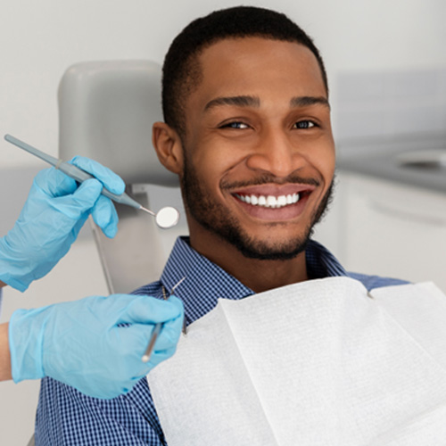 Patient in Arlington Heights smiling after scaling and root planing