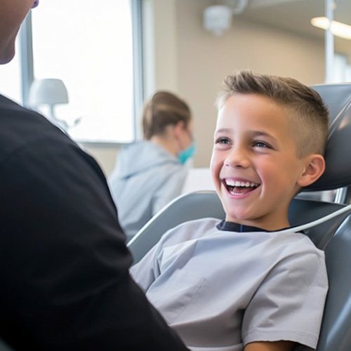 a child smiling after undergoing a dental checkup