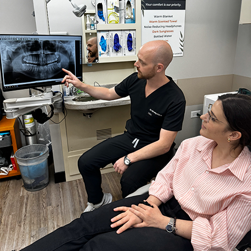 Man holding oral conscious sedation dentistry pill