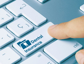 A keyboard with the words dental insurance on a key 