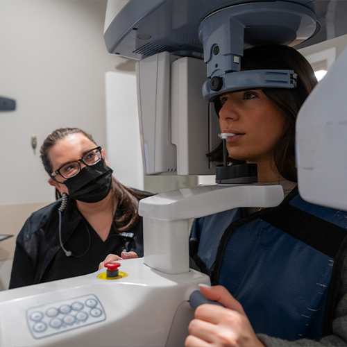 Dental patient having a 3 D cone beam image taken of her head