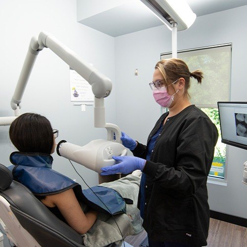 Dental team member capturing digital x-rays