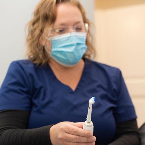 Woman flossing her teeth