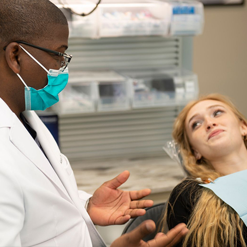 Young woman listening to her dentist