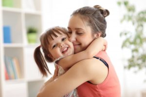 child and parent hugging