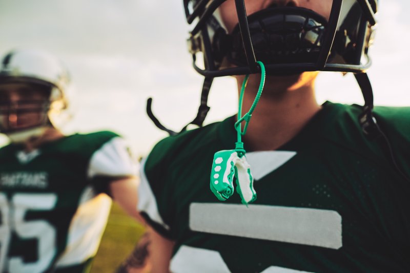 Football player with mouthguard