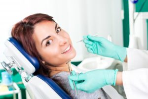 Woman receiving dental exam