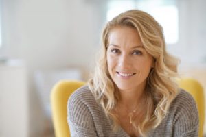 Woman smiling with dental implants 